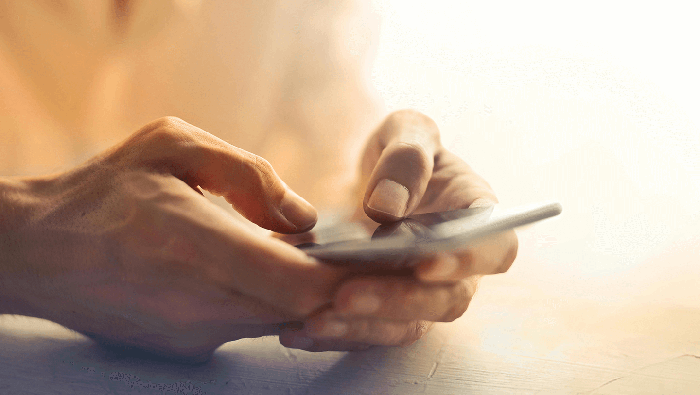 Person holding a phone who may be using Vivowire and Brite Payments.
